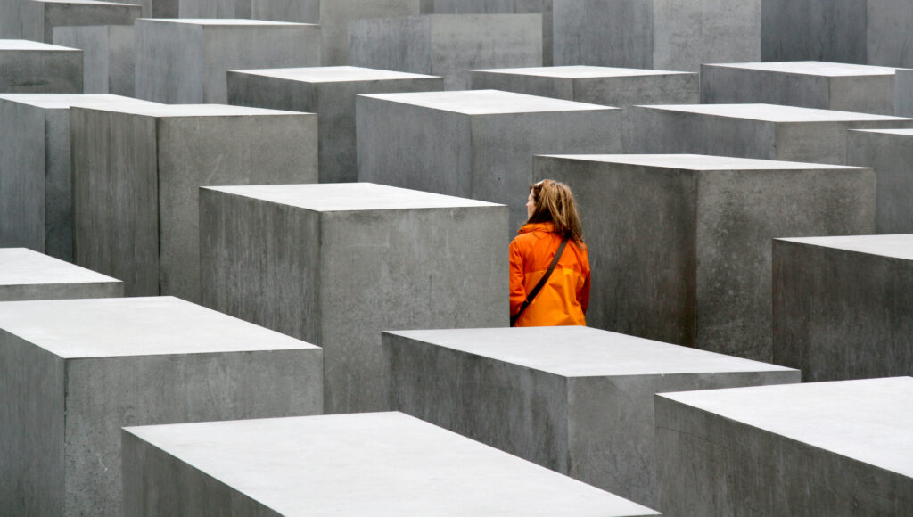 Young woman visiting the Holocaust Memorial in Berlin, Germany